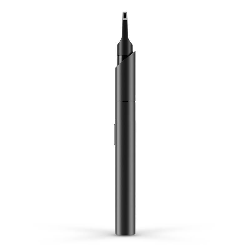 a black pen sitting on top of a white surface