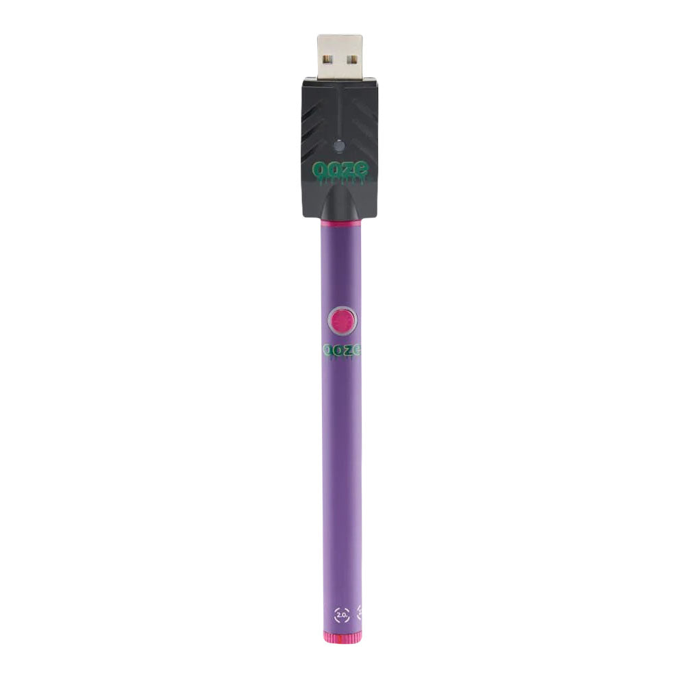 an electronic device with a purple tube attached to it