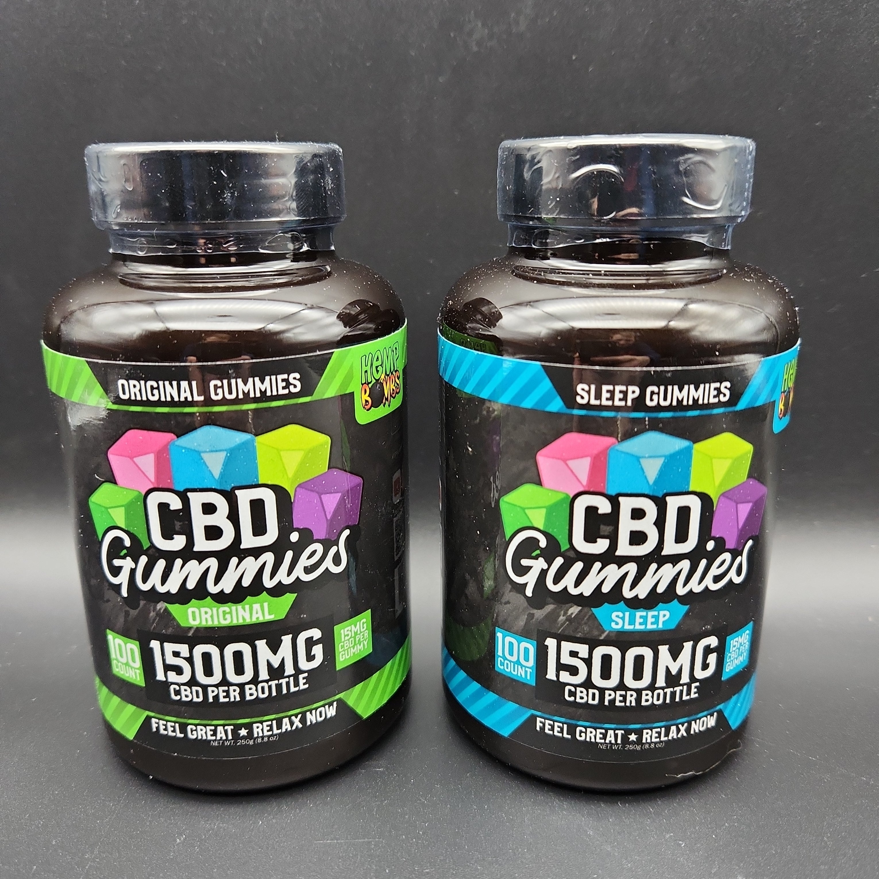 two bottles of cbd gummies sitting next to each other