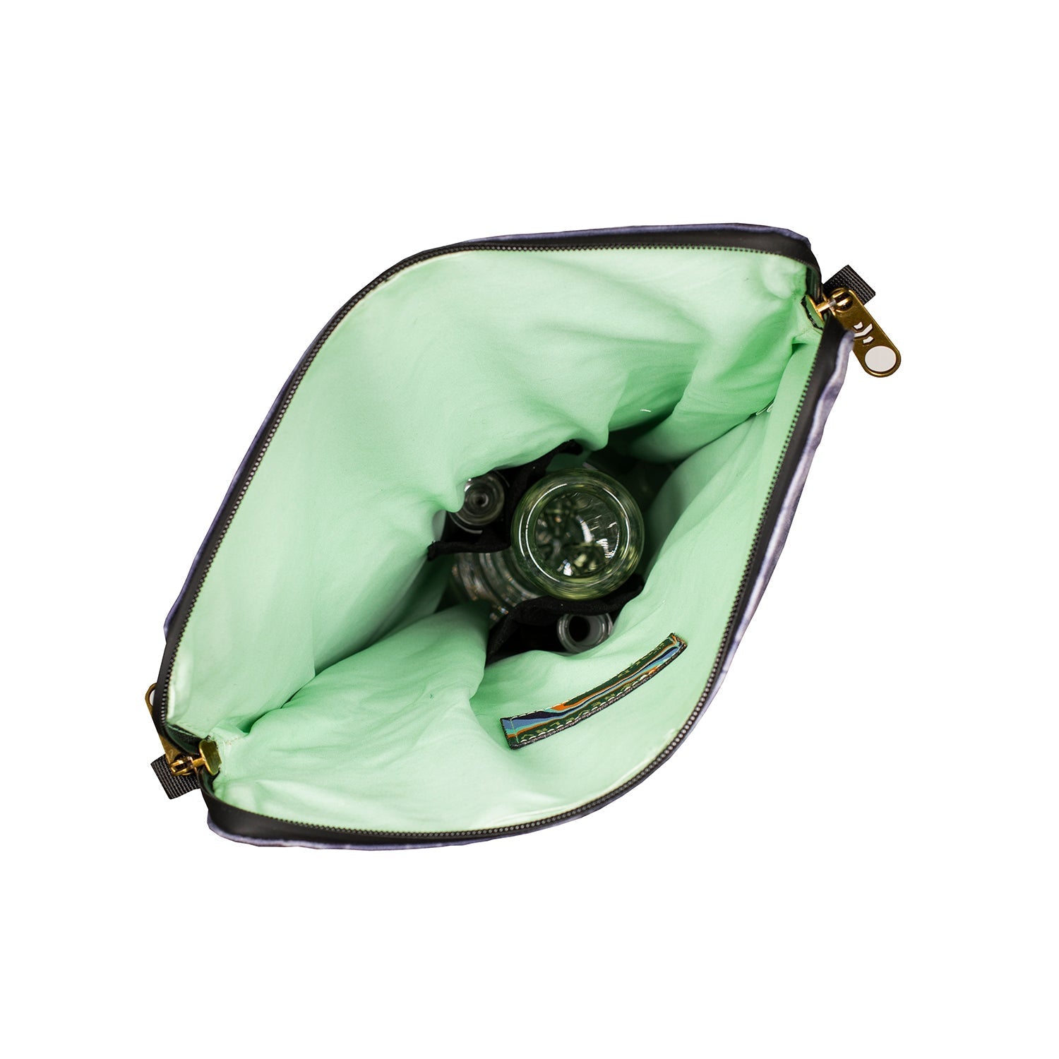 a watch inside of a green pouch on a white background