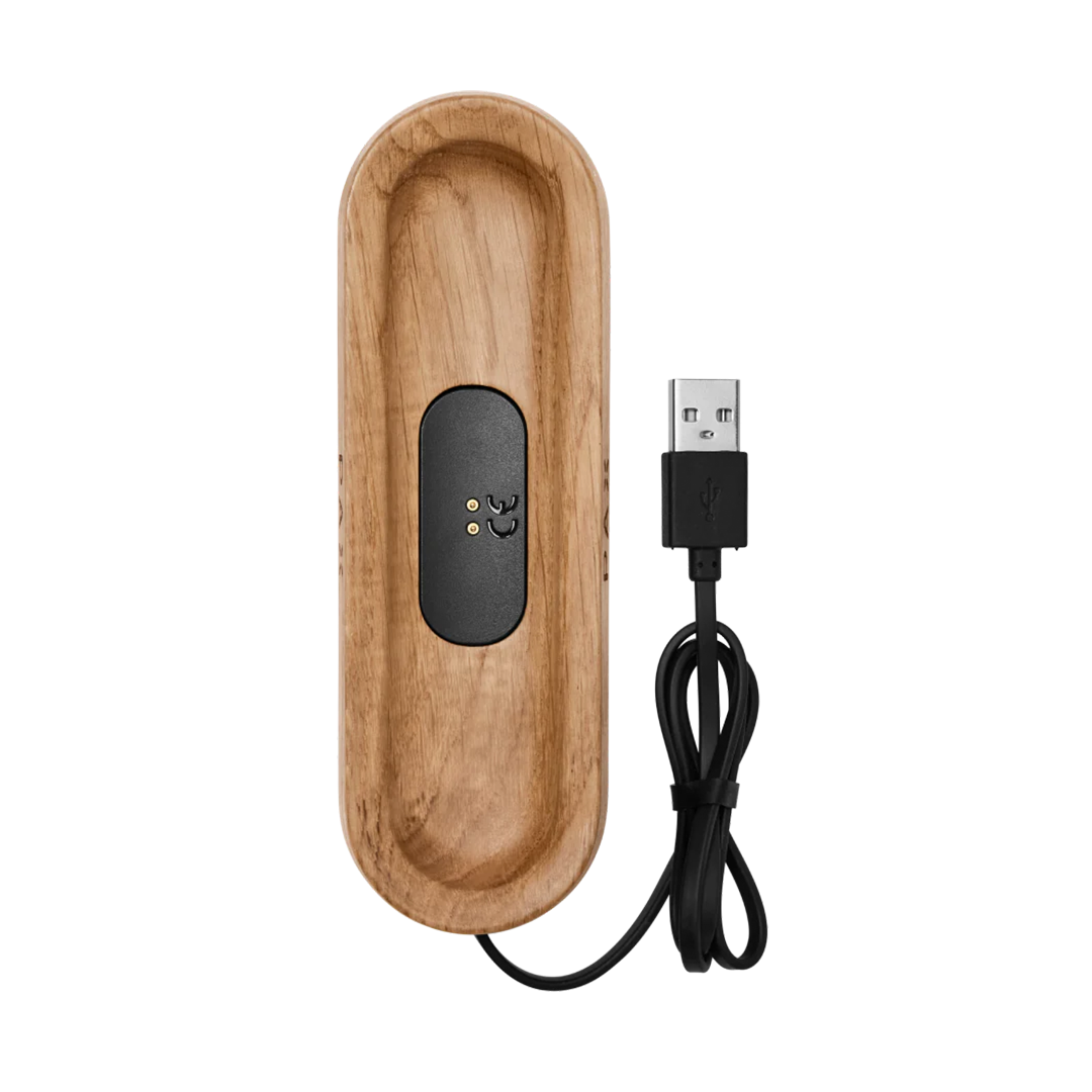 a wooden charger with a usb cable connected to it