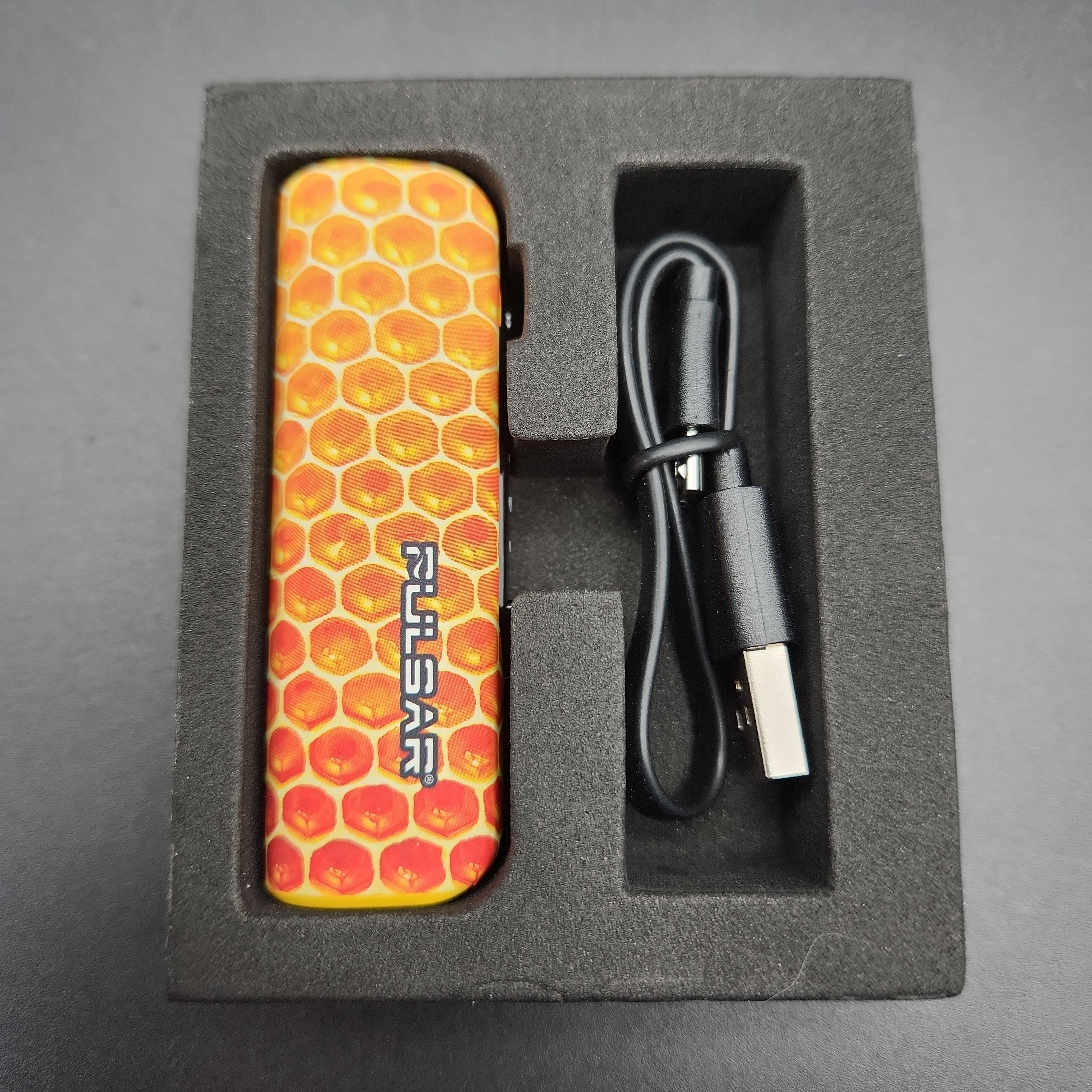 a box with a lighter and a charger in it