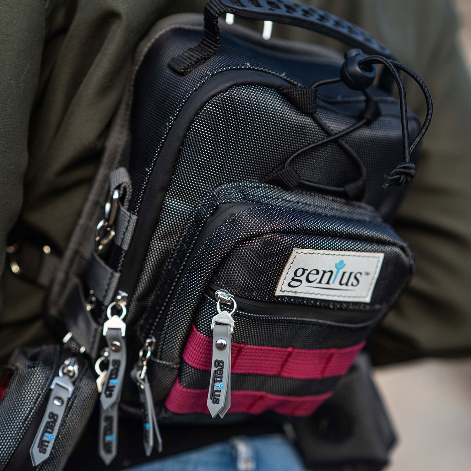 a person holding a black and red backpack