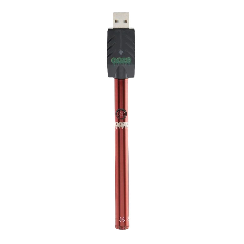 a red metal pen with a green logo on it