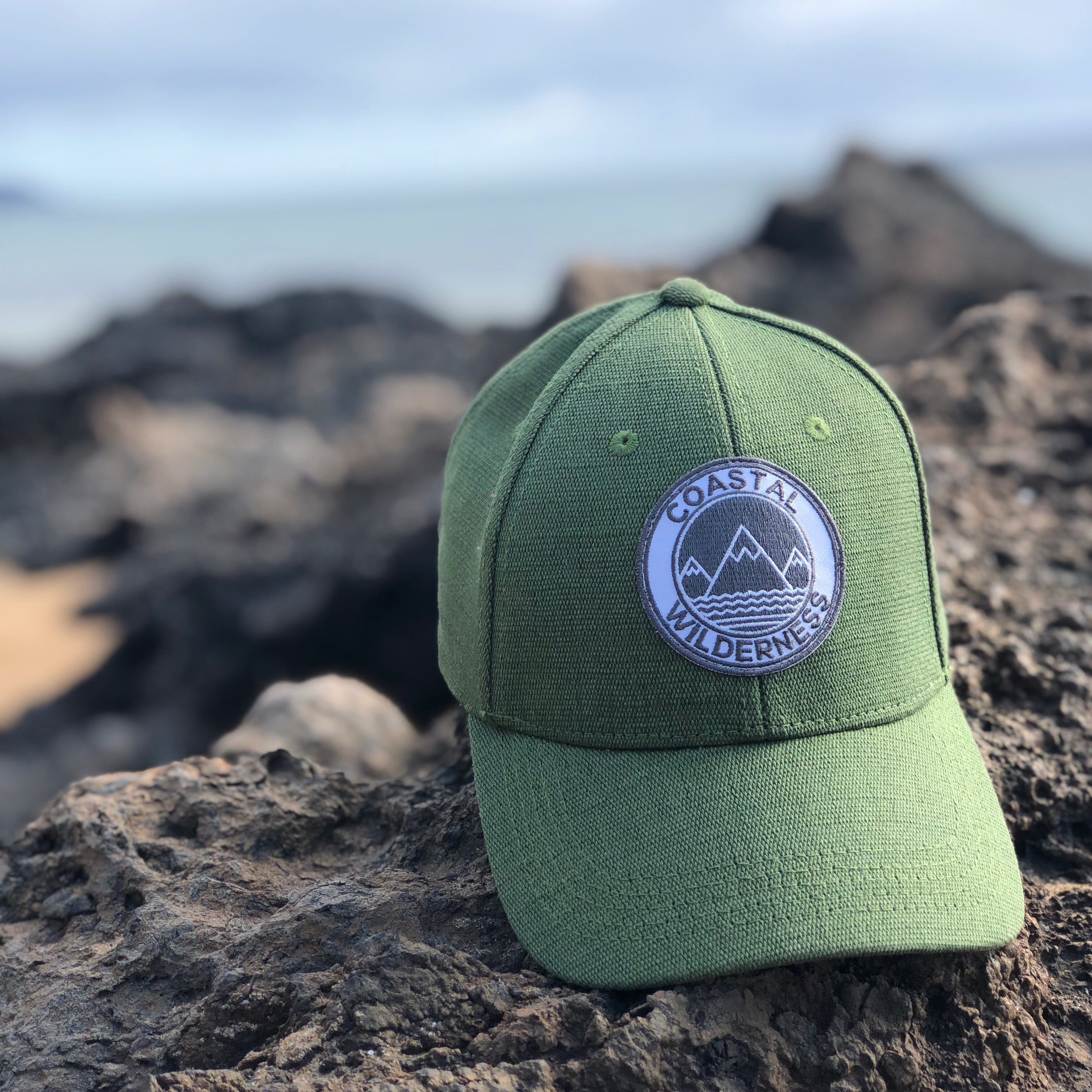 a green hat sitting on top of a rock