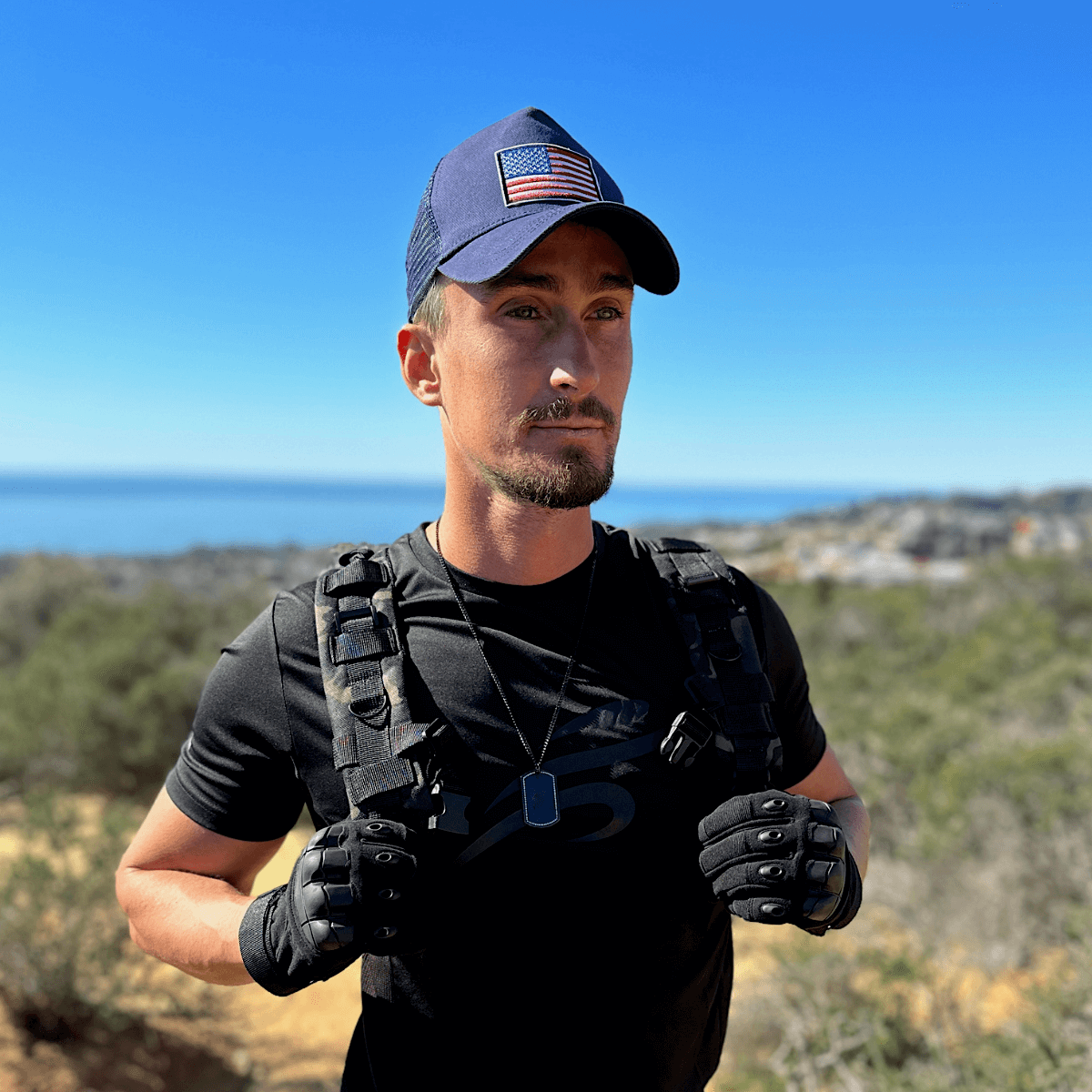 a man with a hat and gloves on