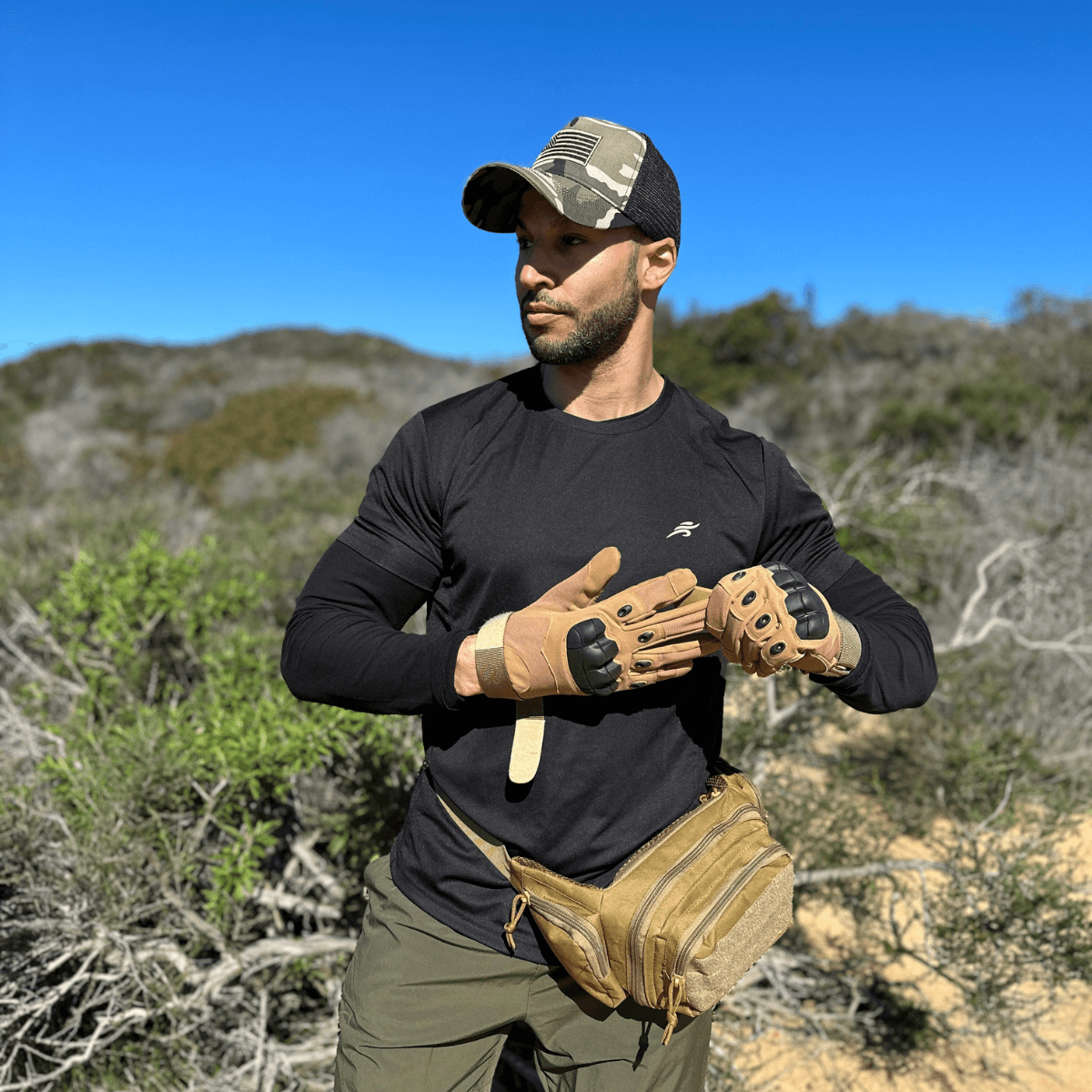 a man in a hat and gloves holding a glove