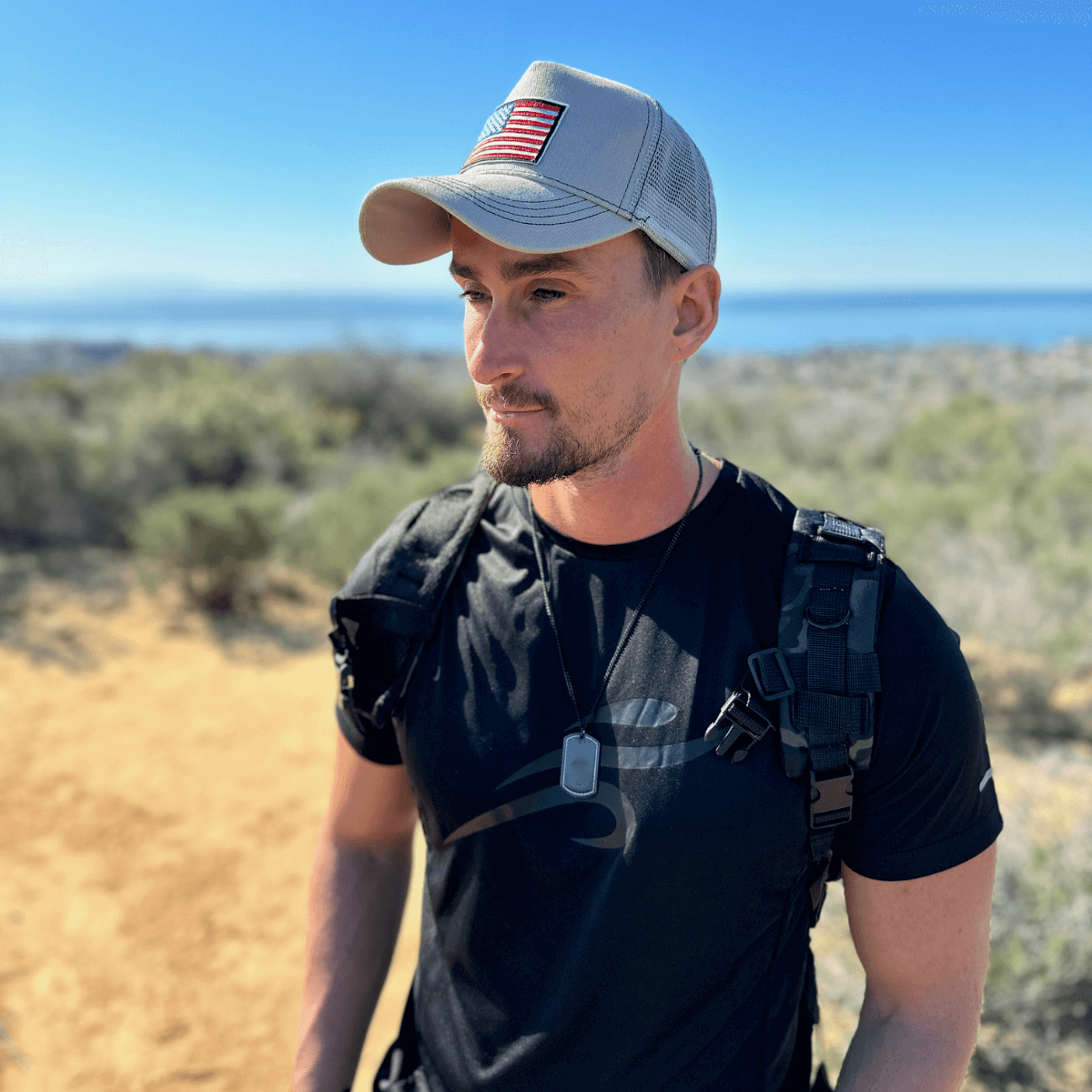 a man wearing a hat and a backpack